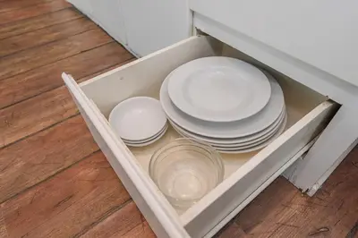 a group of plates and bowls in a drawer at C206 Sea-View Condo 5 Min Walk to Kata Beach in Karon Beach