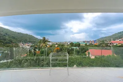 a view of a city from a window at C206 Sea-View Condo 5 Min Walk to Kata Beach in Karon Beach