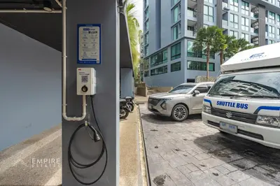 a police car is parked at a gas station at CityGate Kamala 1BR 3 min Beach in Kamala Beach