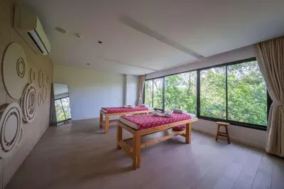 a room with two beds and a large window at \u6f9c\u8fd1 \u7af9\u9690\u5885 Nai Han Waves Edge Retreat in Rawai Beach