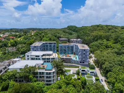 an aerial view of a resort with trees at \u6f9c\u8fd1 \u7af9\u9690\u5885 Nai Han Waves Edge Retreat in Rawai Beach