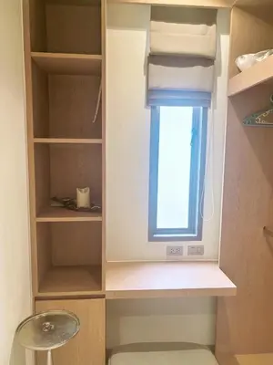 a cupboard with a window in a room at \u7af9\u5149\u522b\u9662 Bamboo Radiance Villa in Ban Thalat Choeng Thale