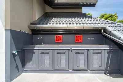 a building with a sink on the side of it at Beautiful 2BR Lakeview Apartment in Laguna in Laguna Phuket