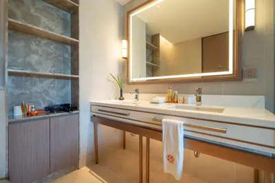 a bathroom with a sink and a mirror at Angsana Oceanview Residence Luxurious 2BR Lakeview Apartment in Laguna Phuket