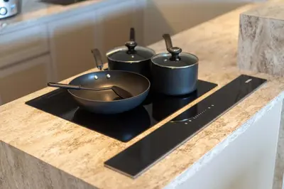 three pots and pans on a stove in a kitchen at Angsana Oceanview Residence Luxurious 2BR Lakeview Apartment in Laguna Phuket