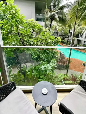 a view of a patio with a table and a pool at Diamond Condominium 1 BR Bangtao beach in Bang Tao Beach