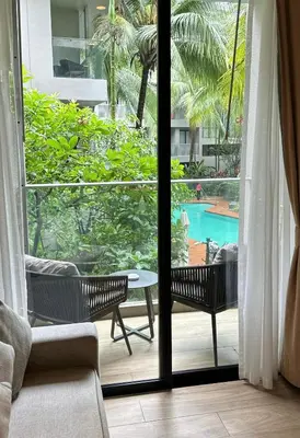 a view of a patio with a table and chairs at Diamond Condominium 1 BR Bangtao beach in Bang Tao Beach