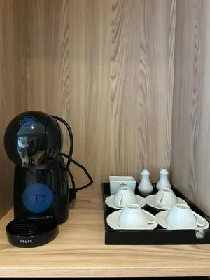 a blender and plates and cups on a table at Diamond Condominium 1 BR Bangtao beach in Bang Tao Beach