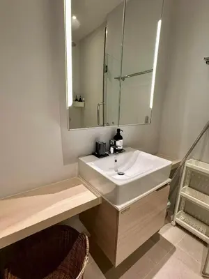 a bathroom with a white sink and a mirror at Diamond Condominium 1 BR Bangtao beach in Bang Tao Beach