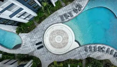 an overhead view of a pool with two swimming pools at Endless white 2BR apartment-300m to NaiYang Beach in Nai Yang Beach