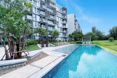 an image of a swimming pool in front of a building at Cassia Lakeview 1BR Apartments, 10min to Beach in Laguna Phuket