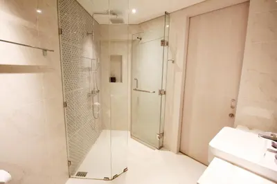 a bathroom with a shower and a sink at Cassia Lakeview 1BR Apartments, 10min to Beach in Laguna Phuket