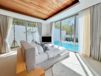 a living room with a couch and a tv and windows at Luxpride 3BR near laguna friendly villa with Garden&pool in Ban Pak Lak