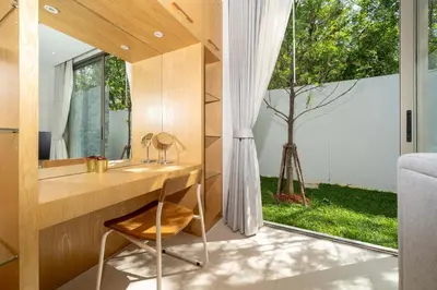 a bathroom with a desk and a mirror and a tree at Luxpride 3BR near laguna friendly villa with Garden&pool in Ban Pak Lak