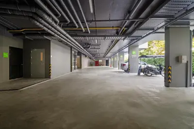 an empty parking lot in a parking garage at Pool View 1412 Elegant Wyndham Condo in Nai Thon Beach