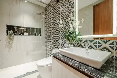 a bathroom with a sink and a toilet at The Ozone Residences Bangtao in Phuket