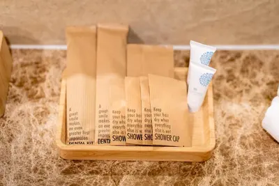 a wooden box with a toothbrush on top of a counter at The Ozone Residences Bangtao in Phuket