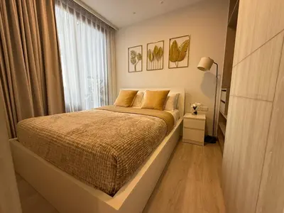 a bedroom with a bed with a large window at 2BR Rooftop Pool & Gym Laguna Skypark in Laguna Phuket