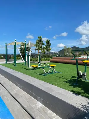 a playground with picnic tables and a swing set at 2BR Rooftop Pool & Gym Laguna Skypark in Laguna Phuket