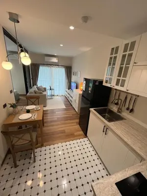 a kitchen and a living room with a table and a kitchen and a kitchen at МЕ4 Halo NEW2 ВатСaп66935B2I976 in Nai Yang Beach