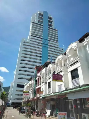a large tall building in the middle of a street at Private 2 Bedroom Seaview at Patong Phuket in Patong Beach
