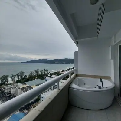 a bath tub on a balcony with a view of the ocean at Private 2 Bedroom Seaview at Patong Phuket in Patong Beach