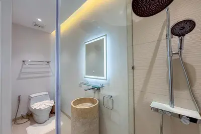 a bathroom with a toilet and a glass shower at New Tropical Modernity! 3BR Pool Villa LuxPride4 L21 near Laguna Phuket in Bang Tao Beach
