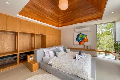a bedroom with a large bed with a wooden ceiling at New Tropical Modernity! 3BR Pool Villa LuxPride4 L21 near Laguna Phuket in Bang Tao Beach