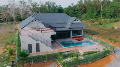 an aerial view of a house with a swimming pool at Seashine Private Pool Villa at Klong Muang in Klong Muang Beach