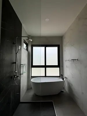 a bathroom with a bath tub and a window at Seashine Private Pool Villa at Klong Muang in Klong Muang Beach