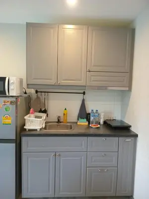 a kitchen with white cabinets and a sink and a refrigerator at В11 Title Naiyang Ватсап669З5В2I976 in Nai Yang Beach