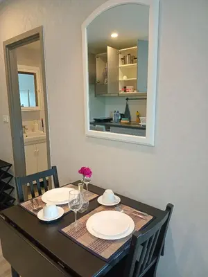 a dining room table with plates and glasses and a mirror at В11 Title Naiyang Ватсап669З5В2I976 in Nai Yang Beach