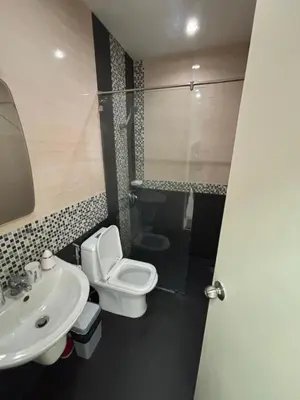 a bathroom with a white toilet and a sink at Laguna Townhouse with private pool and your own gym near Bangtao Beach in Laguna Phuket