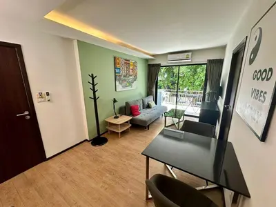 a living room with a couch and a table at Apartment Title I, Rawai Phuket in Rawai Beach