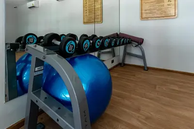 a gym with an exercise ball and a treadmill at Cozy apartment in Title V 400 m to Rawai Beach in Rawai Beach