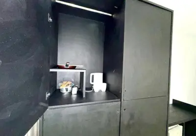 a gray kitchen with a shelf and a sink at Patong Easy Life 3 in Patong Beach