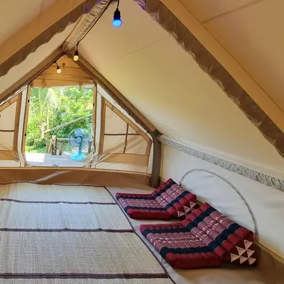 a room with two pillows on the floor in a tent at Sea True Valley Phuket ซี ทรู วัลเลย์ ภูเก็ต in Ban Ao Makham