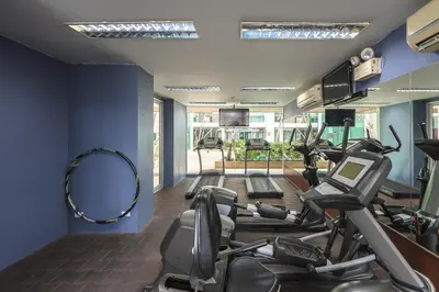 a gym with treadmills and ellipticals in a room at C211 Motorbike Friendly 950m to Patong Beach Pool&Gym in Patong Beach