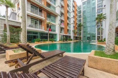a swimming pool in the middle of a building at C211 Motorbike Friendly 950m to Patong Beach Pool&Gym in Patong Beach