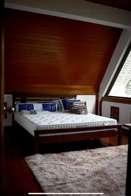 a bed in a room with a window at Вилла с 6 спальнями в районе Раваи in Ban Suan