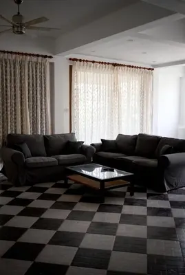 a living room with a couch and a table at Вилла с 6 спальнями в районе Раваи in Ban Suan