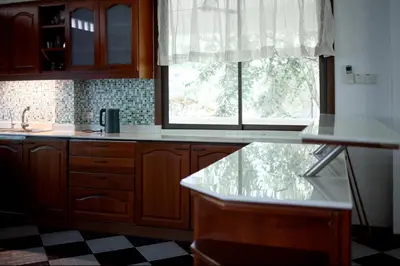 a kitchen with a counter top and a window at Вилла с 6 спальнями в районе Раваи in Ban Suan