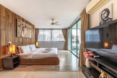 a bedroom with a bed and a large window at V210 Retreat 3BR Top of the Range, Sea View,Lift in Rawai Beach