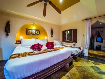 a bedroom with two beds with red bows on them at Luxury 8 - 9 Bedroom Villa With 2 Pools in Kamala Beach