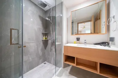 a bathroom with a sink and a shower at Laguna Beachside Apartment 300 meters to the Bangtao Beach in Bang Tao Beach