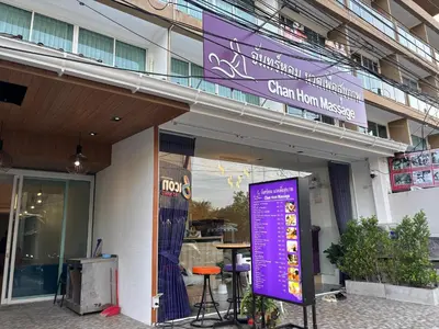 a building with a purple sign in front of it at Aqua Inn Ao Nang in Ao Nang Beach