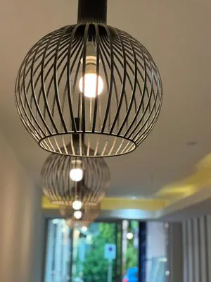 a row of lights hanging from a ceiling at Aqua Inn Ao Nang in Ao Nang Beach