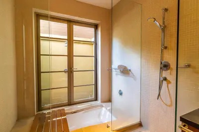 a bathroom with a tub and a shower with a window at Exotic 3BR Villa Solandra with Tropical Pool and Private Rooftop Terrace in Bangtao in Bang Tao Beach