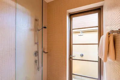a bathroom with a shower and a glass door at Exotic 3BR Villa Solandra with Tropical Pool and Private Rooftop Terrace in Bangtao in Bang Tao Beach