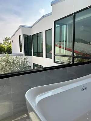 a white bath tub in front of a house at Modern ZEN Vibe 3BR Pool Villa Phuket in Ban Tha Khreng